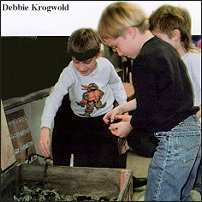 Kids tending worms